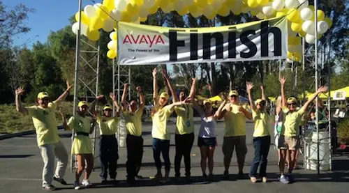Historic photo from Canary Challenge finish line showing volunteers celebrating community involvement in past fundraising events